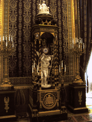 MADRID: Time with his scythe bears the face on this enormous ornamental clock.