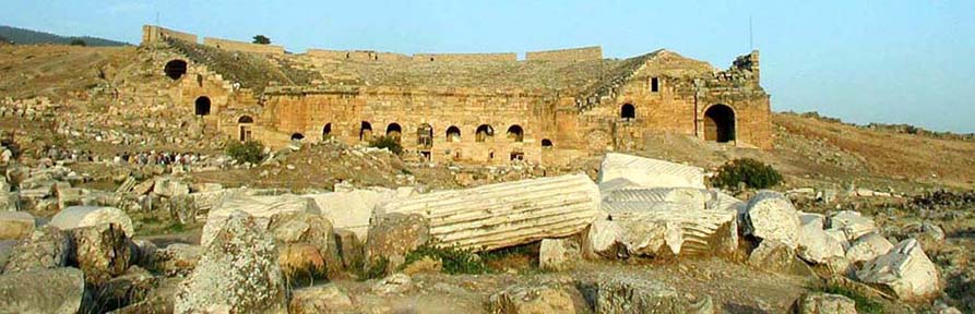 HIEROPOLIS: The Classical-era city of Hieropolis was built to take advantage of the mineral baths at Pamukkale. It sprawls, widely scattered, over the plateau on top of the cliff, behind the Pamukkale Termal (the modern complex offering swimming and soaking pools under a roof, surrounded with expensive ice-cream and souvenir stands). This is the Hieropolis theater. Unfortunately we made it to this part of the site too late in the day to explore much else. To explore Hieropolis thoroughly, you need time and good walking shoes.