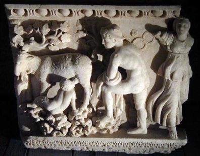 HIEROPOLIS: The old Roman baths have been reconstructed as a wonderful museum in a series of buildings between the pool and the cliffs. The busloads of tourists mostly head straight for the modern baths, but the museum is definitely worth a visit. Here the infant god Dionysus is suckled by a goat while Hermes looks on. Note the Dionysian vine leaves spreading overhead. A similar story is told of Zeus, but the label in the museum calls this figure Dionysus. Much of this sculpture is attributed to the School of Aphrodisas, a brilliant center for such art just south of here. The swirling robes of the woman on the right are typical of their work.