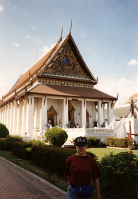 Megan Brians standing in front of one of many buildings making up the museum. After a good lunch at Silom Village, we took a long taxi ride (Bangkok is quite spread out) to the National Museum, where we had to race to see as many exhibits as possible before the dreaded rush-hour traffic set in.