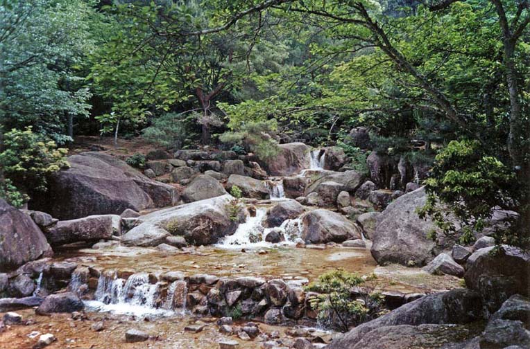 MIYAJIMA: Note the Japanese penchant for improving on nature--an artificial cascade has been added to this stream in the foreground. Taken along the path to the chairlift up Mt. Mizen on Miyajima Island, one of the famed beauty spots of Japan. May 18, 1998