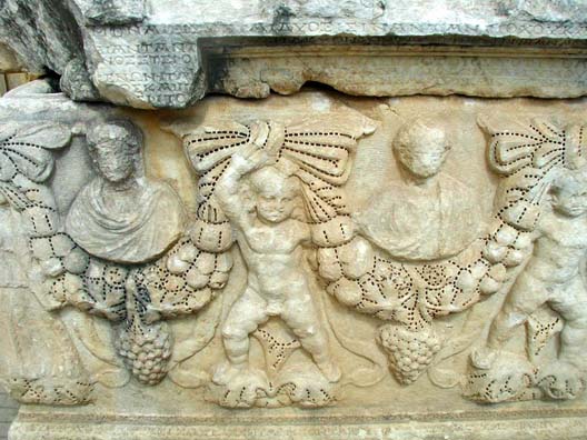 AFRODISIAS: The carving on this tomb was never finished, so you can clearly see the technique by which the sculptors drilled rows of holes to outline the shapes and then proceeded to carve using a connect-the-dots technique.