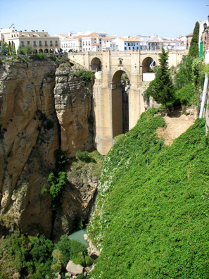 RONDA: A bridge takes visitors high over the stream below.