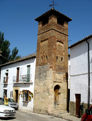 RONDA: A rare surviving Moorish minaret, c. 14th C. The arch over the doorway is of distinctively Morish design. Now attached to private dwellings. It was converted into the belltower of a Christian Church devoted to St. Sebastian in the Christian era.