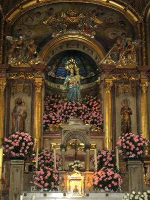 RONDA: The altar inside was covered with pink flowers.