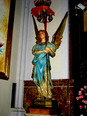RONDA: A charming angel beside the altar