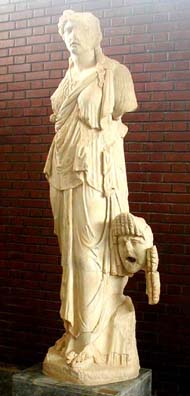 AFRODISIAS MUSEUM: This sculpture is of the Muse of tragedy, Melpomene, with a tragic actor's mask beside her.
