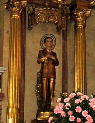 RONDA: It is striking to see this saint in modern dress.