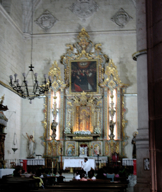RONDA: The mothers and their children listen to a lively priest.