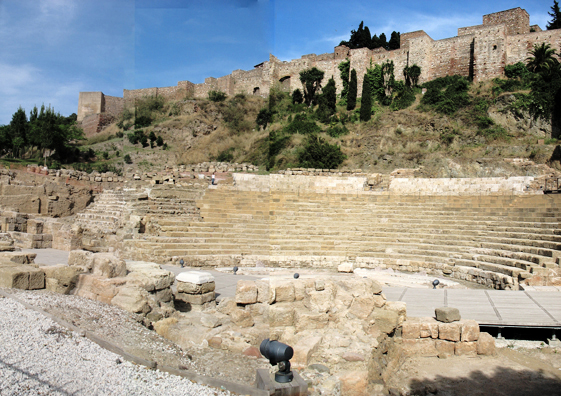 MALAGE: Tourists go to Málaga mainly for the large Picasso museum here, which houses Guernica, home at last in Spain in the post-Franco era. The artist had stipulated that the painting should never enter Spain until the fascist dictator had died. The museum is housed in a lovely old mansion beautifully remodeled. The entrance is a bit hard to find, and security is very high. Not only is photography forbidden—you have to check your camera at the entrance. So I have no photos from the museum. However, we also paid a brief visit to the Alcazaba (a Moorish castle) and the Roman theater excavated below it. Above, the view of the theater seats from behind the stage, with the walls of the Alcazaba rising on the hill behind it.