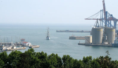 MALAGE: Looking from the gardens at a sailing ship leaving the harbor below; obviously using its engines since no sails were set.