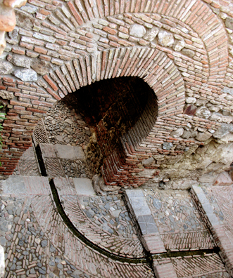 MALAGE: A view of another arch from above shows one of the channel that conducts water around the palace and into the gardens.