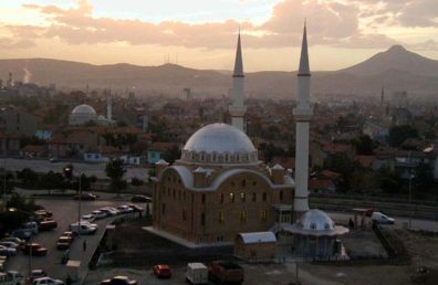 KONYA: Konya is a huge city, and it takes a long time to get from the otogar by taxi (even if your driver is honest--we ran into both kinds in Konya). A very inexpensive green trolley can take you from your bus to downtown, but it's slow and crowded. A good choice for backpackers with plenty of time; but we took a taxi. We chose the luxurious Hotel Bera since we were going to spend only one night. Here's the view out our hotel window at dusk. Konya is a conservative city and not very friendly to tourists (whenever possible, get the hotel staff to summon a cab for you). Most women cover their hair here, unlike in the areas we visited earlier, and many also veiled their faces. We were stared at as oddities on the street and many of the people we dealt with were as grouchy as a New York City cabdriver.