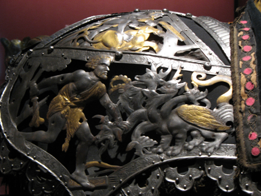 MADRID: This striking detail ornaments a shoulder piece showing Hercules slaying a hydra. In the Armera in the Palacio Ral.