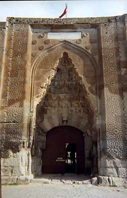 CAPADOCCIA: We enjoyed walking around the Agzikarahan Caravansaray (Kervanseray), a stopping point for merchants on the old Silk Route where caravans would settle down for extended periods, engaging in trade. Smaller caravansarays were sprinkled a day's journey apart all along the route, punctuated periodically by these more impressive fortified trading centers. The carved door is handsome, and we admired the soaring vaults inside; but there's not much to see here unless you want to spend time in the carpet shop.