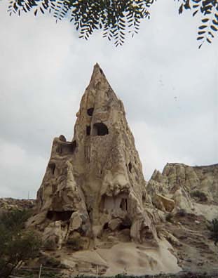 CAPADOCCIA: A former convent; on the right, the decoration on one of the site's many churches whose exteriors have been worn away by the elements. You don't need an expensive tour to visit cave churches: the most beautifully preserved are right here in the Outdoor Museum.