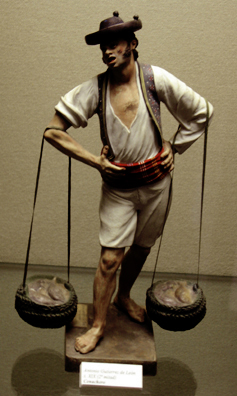 MALAGE: There were numerous souvenir miniatures like these made by local craftsmen, depicting traditional costumes and occupations. This one is a fish street vendor. In Museo de artes y costumbres populares, Mlaga.