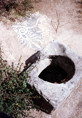 CORINTH: Fragment of a mosaic beside a cistern.