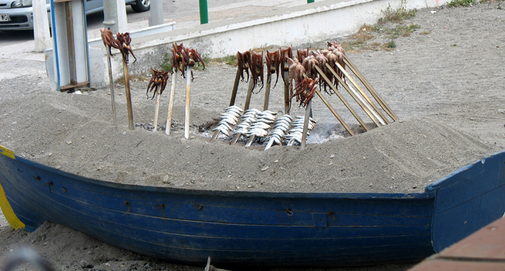 SALOBERNA: Outside El Peon restaurant in Salobrea we dined on paella at a restaurant on the beach which roasted fish in an old boat outside.