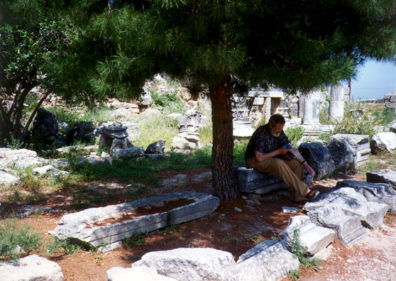 CORINTH:Don Bushaw reading his guidebook outside the Corinth museum.