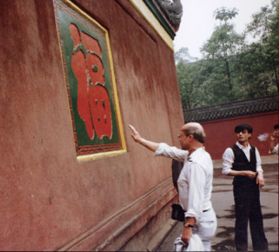 TEMPLE OF DIVINE LIGHT: At the entrance, visitors tried to touch a lucky character with their eyes closed, striding from across a courtyard. Although several tried, Terry Cook was the only successful one from our party.