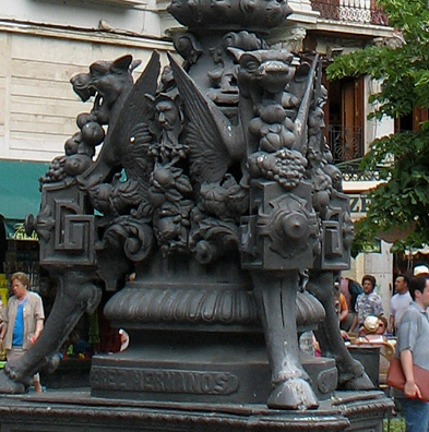 GRANADA: Detail of the dragons decorating the base.