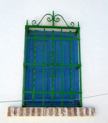 GRANADA: Colorfully painted windows in the Albaicín.