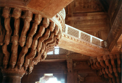 The architecture is a graceful blend of styles done in native red sandstone, reflecting Akbar's eclectic tastes. Born a Muslim of Afghan ancestry and influenced by Persian civilization, he was drawn to many religions, including Hinduism and Christianity, and ended by creating a synthesis of his own. Here Akbar sat atop a central pillar above his petitioners and dispensed justice. Islamic pierced screens blend with the typically Hindu capitols. Fatehpur Sikri was built by the Emperor Akbar as a new capital of the Mughal Empire, but was occupied only from 1570 to 1586.