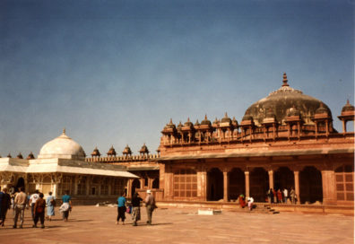 Mausoleum of Sheikh Salim Chishti, built of white marble contrasting with the red sandstone buildings surrounding it. The tomb of this holy man is sought out by women seeking to conceive a child. Fatehpur Sikri was built by the Emperor Akbar as a new capital of the Mughal Empire, but was occupied only from 1570 to 1586.