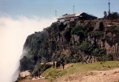 MT. EMEI: Travelers for centuries have reported seeing circular rainbows with their silhouettes enclosed. A rare, but photographable phenomenon (commercial photo). Our own experience of the site was considerably less romantic.