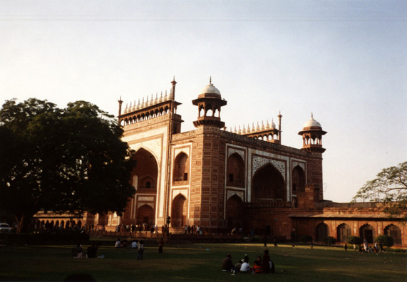 The setting sun casts long shadows in front of the magnificent gateway through which one enters the grounds. 17th C.