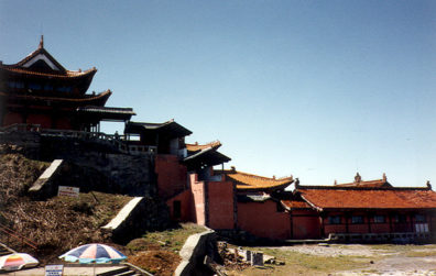 MT. EMEI: The place was actually a dump: run-down, littered, with broken concrete and rubble everywhere. Cloth rags were tied to trees as offerings--traditional, but ugly.