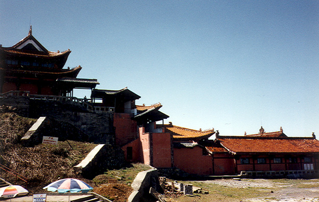 MT. EMEI: The place was actually a dump: run-down, littered, with broken concrete and rubble everywhere. Cloth rags were tied to trees as offerings--traditional, but ugly.