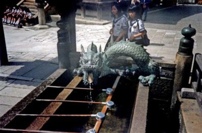 KYOTO: Every temple has a drinking/washing fountain in front of it where visitors may purify and refresh themselves. Several featured fanciful spigots like this drooling dragon at the Kiyomizu-dera temple. Japan beats any other country we have been in for availability of drinkable water and clean bathrooms. Yes, including the U.S. May 14, 1998.