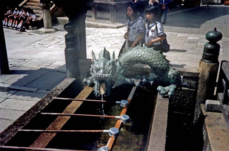 KYOTO: Every temple has a drinking/washing fountain in front of it where visitors may purify and refresh themselves. Several featured fanciful spigots like this drooling dragon at the Kiyomizu-dera temple. Japan beats any other country we have been in for availability of drinkable water and clean bathrooms. Yes, including the U.S. May 14, 1998.