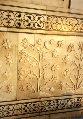 Detail of carved floral relief decorations in the marble walls of the Taj Mahal. Above and below, semiprecious stone inlay work. 17th C.