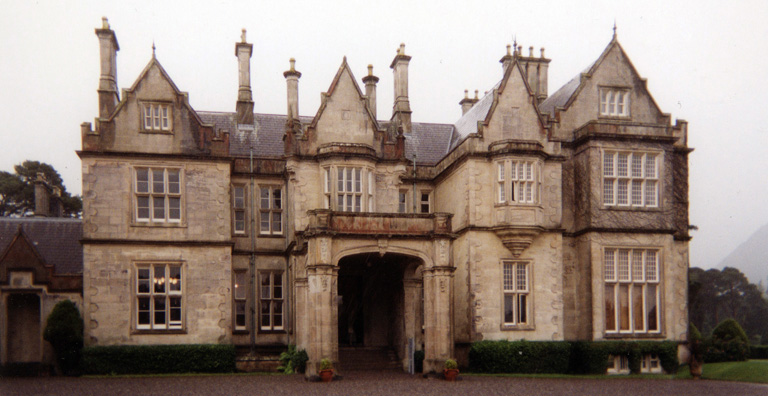 MUCKROSS HOUSE: Kenmare was charming, but drowned under a downpour so heavy we had to give up the idea of driving the Ring of Kerry, and retraced our path across the mountains through the park, stopping to tour Muckross House, a pleasant country estate once visited by Queen Victoria.