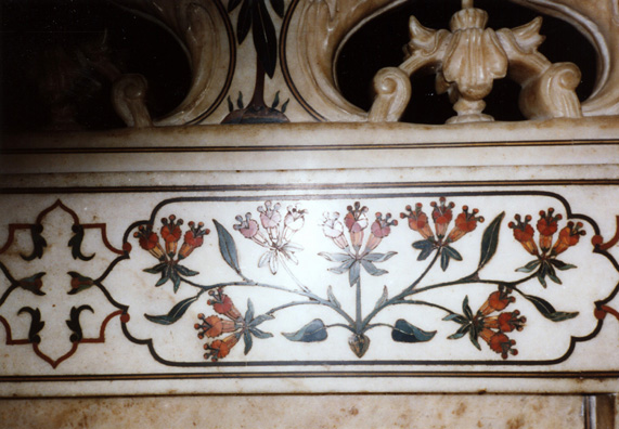 Detail of the colored stone inlay in the chamber over the tomb of Mumtaz Mahal. 17th C. The further you penetrate into the mausoleum, the more delicate and rich the decoration becomes. The armed guard stationed to prevent photography inside the tomb instead passively watched me take this photograph and then extorted 50 rupees as "fees." On the way out I noticed a sign warning visitors not to pay fees charged by anyone working at the tomb. Our only other encounter with government corruption was having the armed security guards extort bribes from us as we were screened leaving the country at the Calcutta airport. One of them asked me for a "birthday present," but I felt I'd paid my dues in Agra and refused--the only one to get through to the boarding area free.