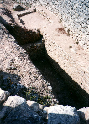 MYCENAE: One of the famous trench tombs in which the treasure of Mycenae was found.