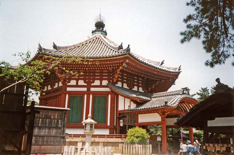 NARA: May 21: We took the shinkansen to Nara, the city which was briefly (710-794) the capital of Japan before Kyoto. Considering that Japan’s civilization does not go back many centuries earlier than this, it is astonishing how many remnants of the old imperial culture have been preserved. A colorful temple near the beginning of our walk. It was near the Kofuku-ji Temple, which we failed to identify (or photograph).