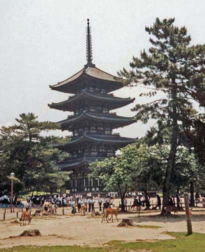 NARA: Tame deer wander in front of this pagoda in the vast park at Nara. Vendors sell small seed "cookies" to feed the deer. May 21, 1998