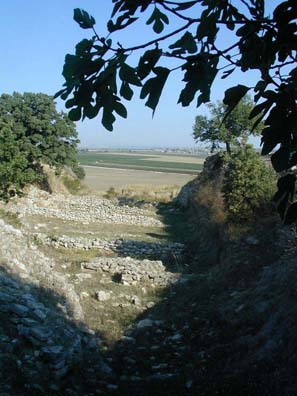 TROY: These are the foundations of ancient stone houses built in Troy I (3000-2500 BCE), with the battle plain in the background.