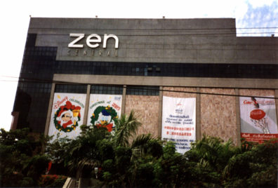 Mickey Mouse and Donald Duck wishing people a Merry Christmas from the windows of the Zen Center.