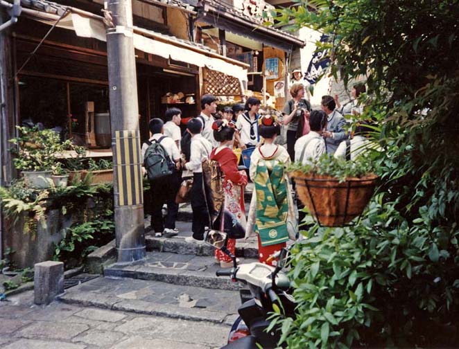 KYOTO: Performers from the Gion Corner theater in the traditional costumes of apprentice geishas (much more showy that the full geisha's regalia). These girls wandered around the Gion district posing with tourists and drumming up customers for the show. May 14, 1998.