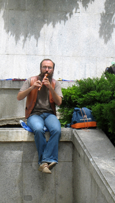 MADRID: A street musician plays Renaissance dance tunes on his recorder outside the entrance to the Prado Museum, Madrid.