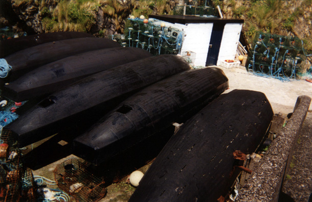 DINGLE PENINSULA: At the bottom of the landing were stored a number of upturned traditional ballyboats, now used to go after lobsters. The one on the right is in serious need of mending.