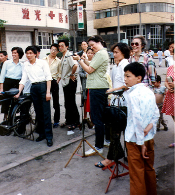 LESHAN: Bonnie wowed a crowd with her expert Texas marksmanship at a balloon-shooting stand along the riverfront (Marina in glasses).