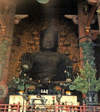 NARA: For centuries this was the largest cast-metal Buddha in the world, made of 437 tons of bronze. The original was even larger, but it was destroyed in an earthquake. To get a sense of scale, note the white dishes holding oranges on the left and right. In the Daibutsu Hall, Todai-ji Temple, Nara. May 21, 1998