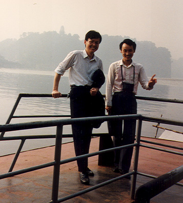 LESHAN: May 19: Mr. Cai and the Russian-speaking guide on the boat on the way to the Big Buddha.