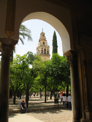 CORDOBA: The view across the courtyard to the tower gives some sense of the building’s immense size. The trees are planted in rows corresponding with the rows of pillars inside. Originally the courtyard would have been open and the effect more apparent.